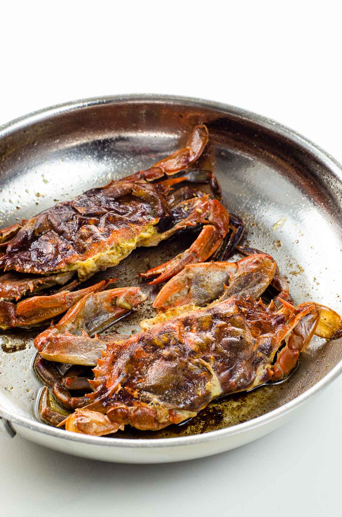 simple soft shell crab recipe sautéed without flour, in a frying pan