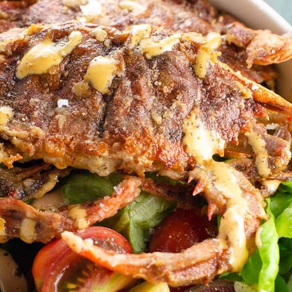 soft shell crab recipe with salad and spicy sauce in a bowl