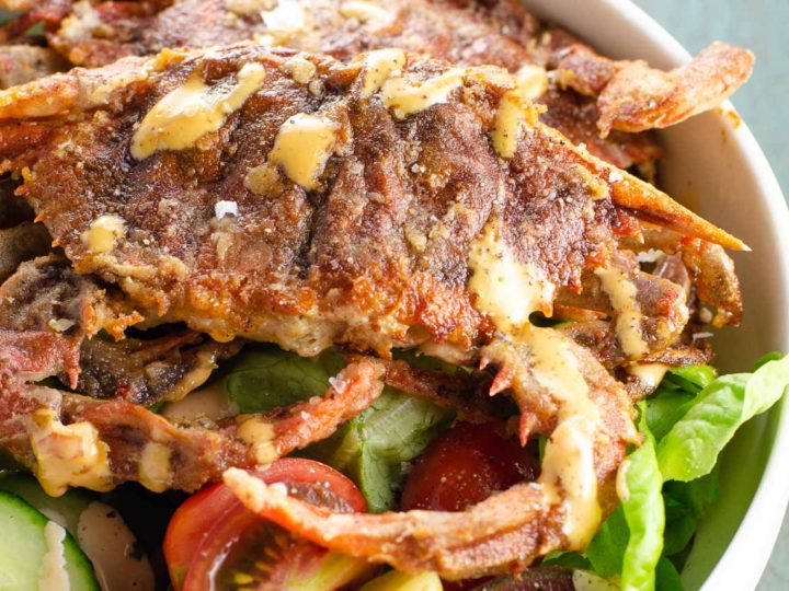 soft shell crab recipe with salad and spicy sauce in a bowl