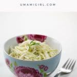 kohlrabi remoulade in a beautiful blue and pink bowl with a fork
