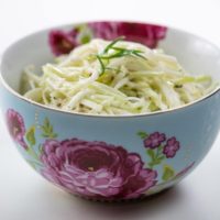 kohlrabi remoulade in a beautiful blue and pink bowl