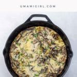 shiitake, potato, and garlic scape frittata in a cast iron pan