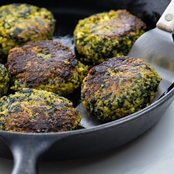 fava bean burgers in a cast iron skillet