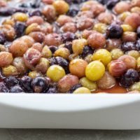 roasted grapes in a white pan