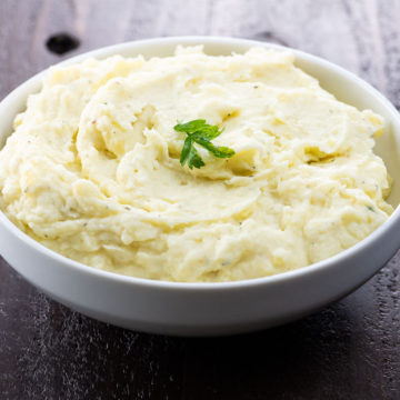boursin mashed potatoes in a white serving bowl
