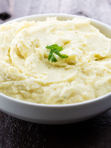 boursin mashed potatoes in a white serving bowl