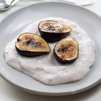 honey roasted figs over yogurt on small plates