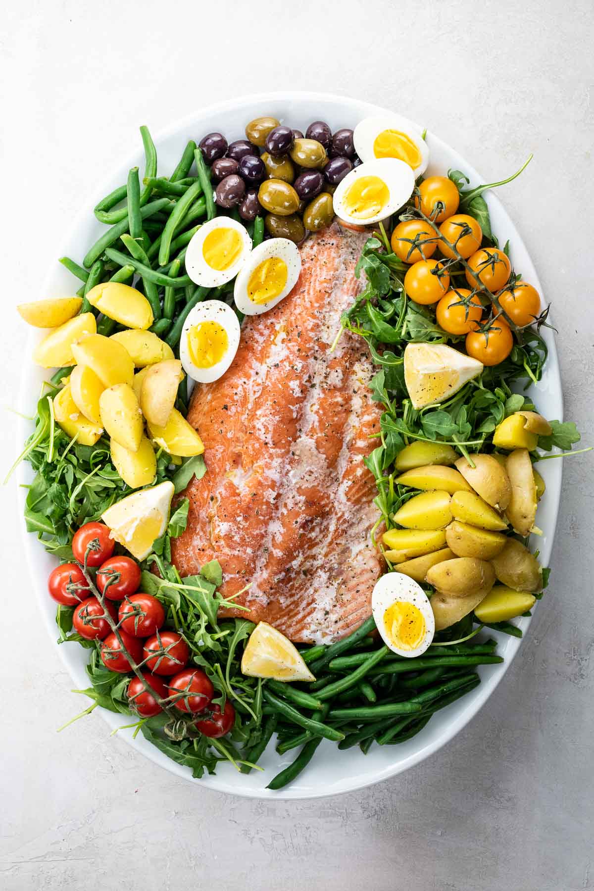 Salmon Nicoise salad on a platter