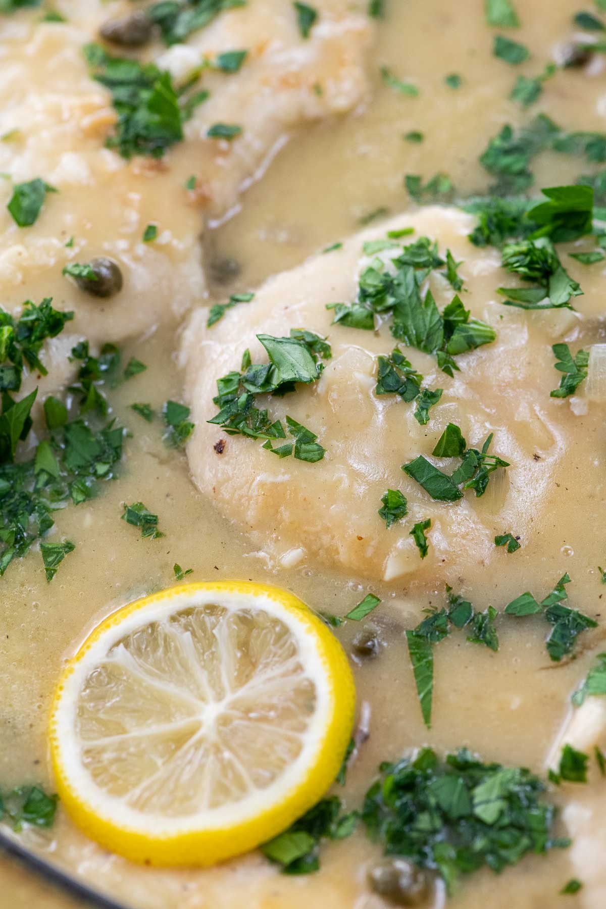 extra saucy chicken piccata in a pan