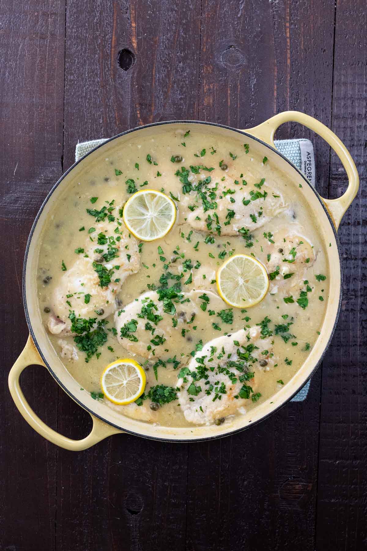 extra saucy chicken piccata in a pan