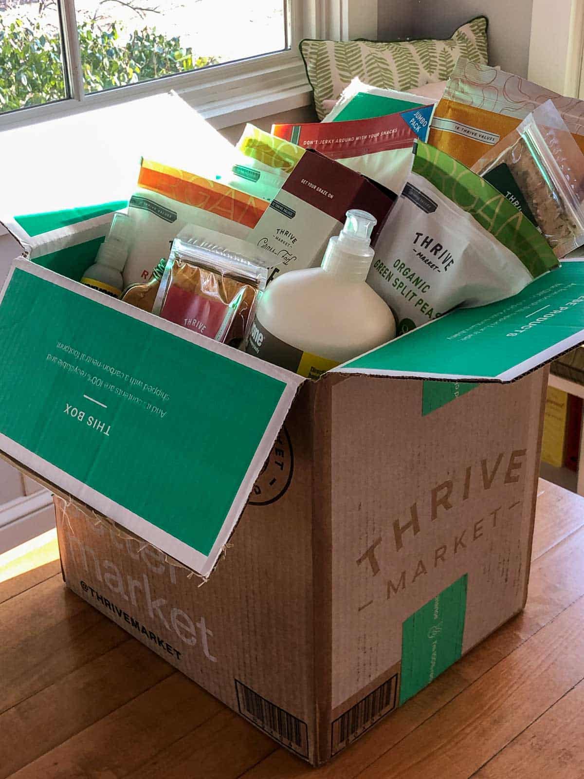 a full box from Thrive Market on a table