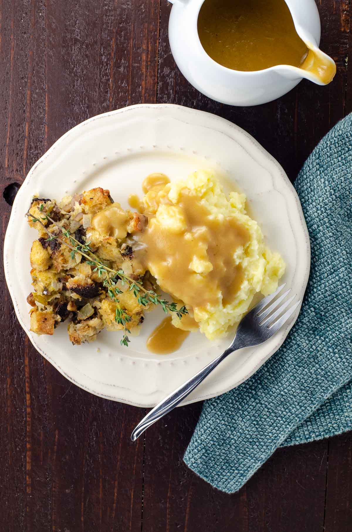 yukon gold mashed potatoes from a small batch on a plate with stuffing and gravy