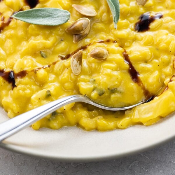 creamy roast pumpkin risotto with sage in a wide, shallow bowl