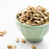 roasted savory pumpkin seeds in a small bowl