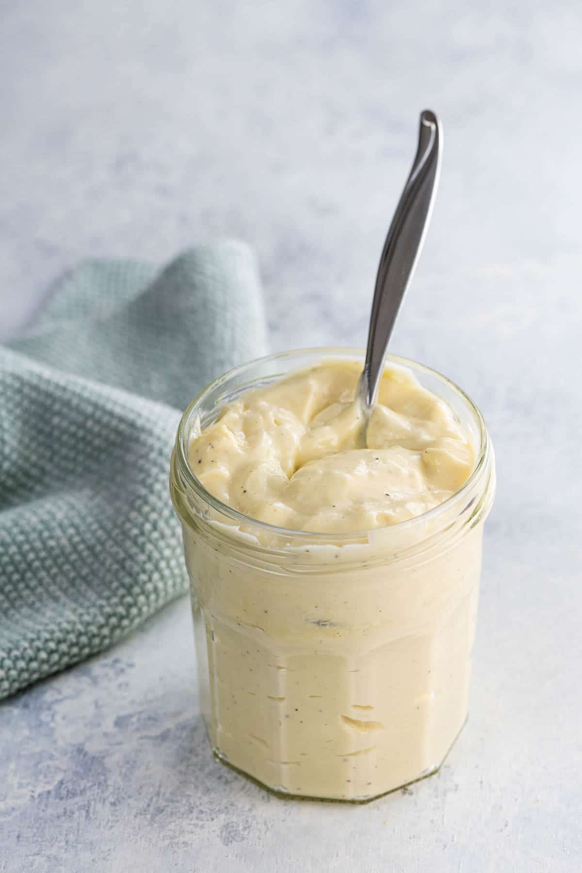 immersion blender mayo in a jar with a spoon and a napkin