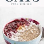 instant pot oatmeal recipe garnished with raspberry compote, peanut butter, and shredded coconut in a bowl with a spoon