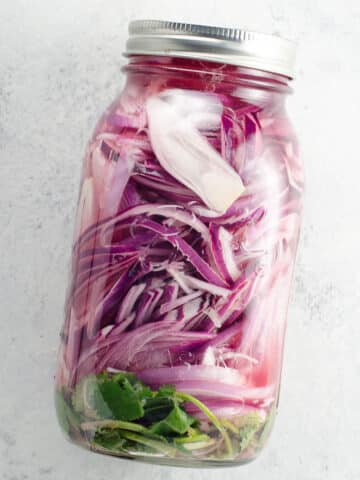 pickled red onions for mexican food in a mason jar