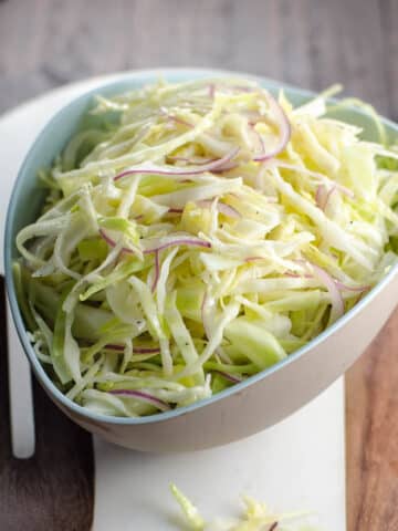 alice waters vegan coleslaw (made with no mayo) in a bowl
