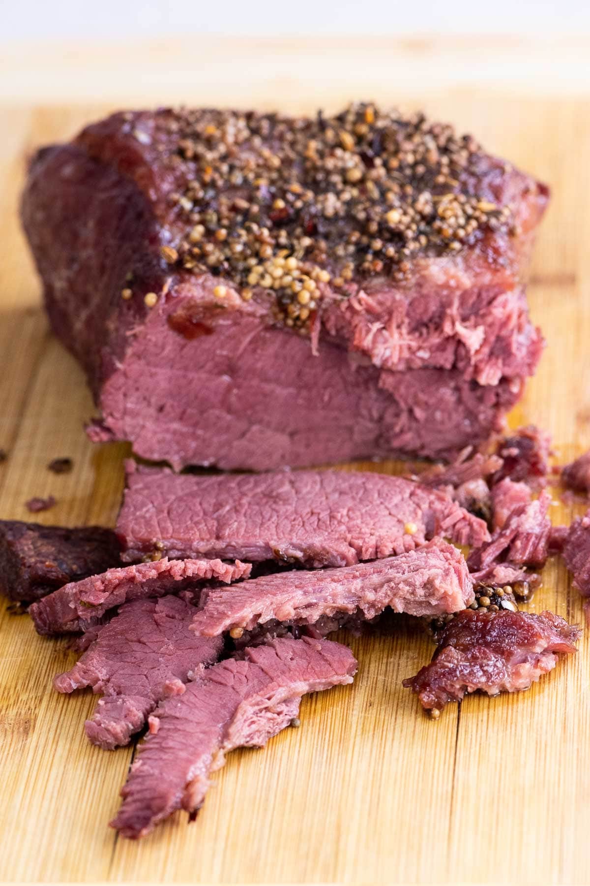 baked corned beef on a cutting board