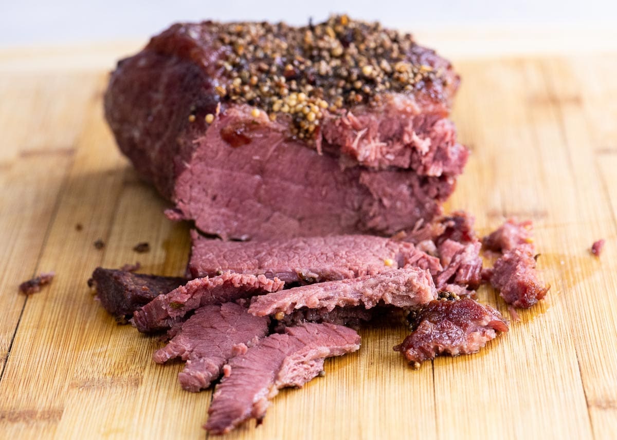baked corned beef on a cutting board