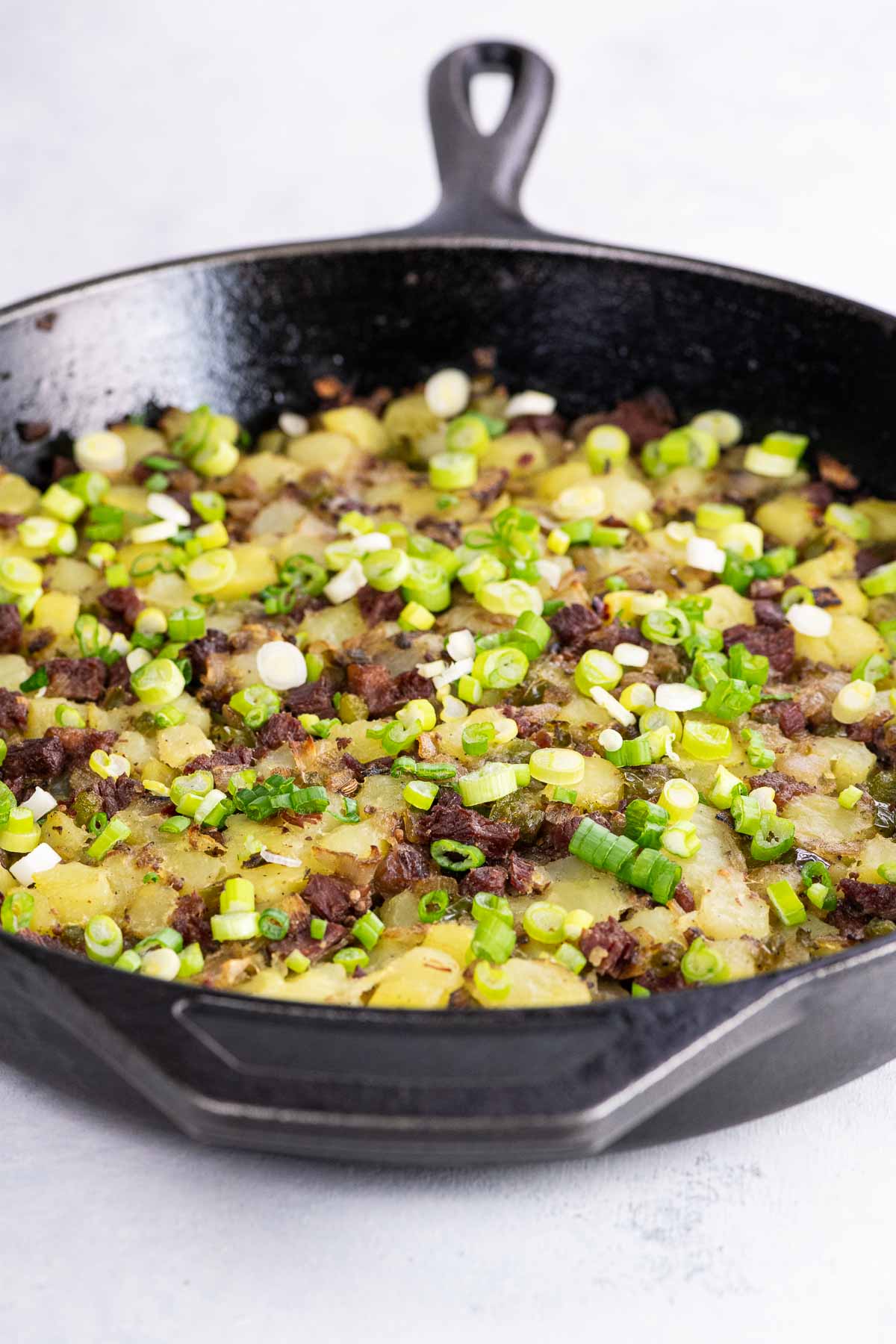 crispy corned beef hash in a cast iron pan