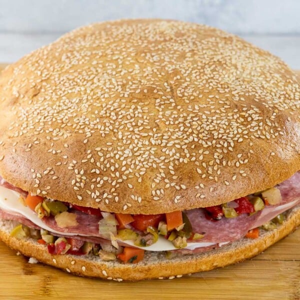 a classic muffaletta sandwich on homemade muffaletta bread