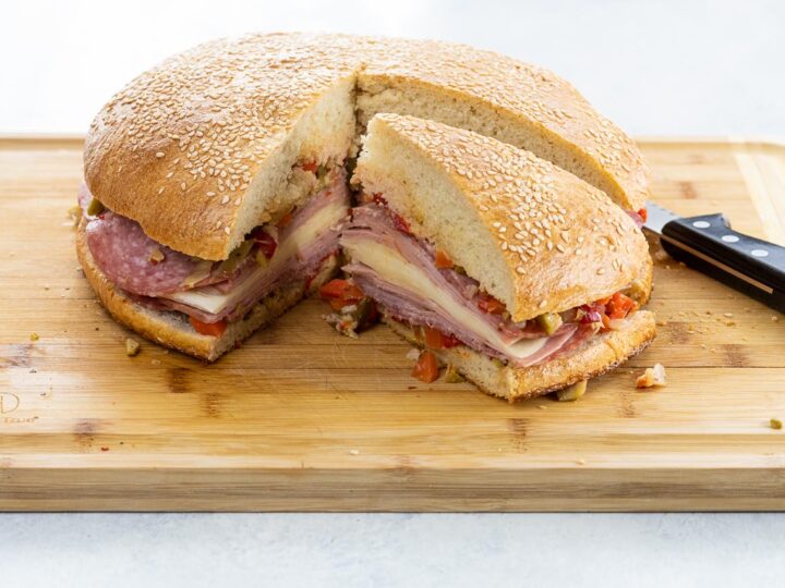 a classic muffaletta sandwich on homemade muffaletta bread