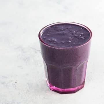 This stunning purple superfood smoothie combines antioxidant-rich wild blueberries, raw cacao, maca, flax, and more in to a creamy, satisfying, mood- and energy-boosting drink.
