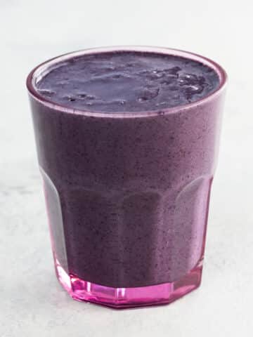 This stunning purple superfood smoothie combines antioxidant-rich wild blueberries, raw cacao, maca, flax, and more in to a creamy, satisfying, mood- and energy-boosting drink.