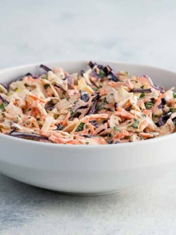 a bowl of tangy cabbage slaw for tacos