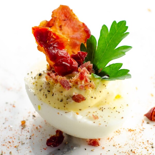 a BLT deviled egg on a marble background