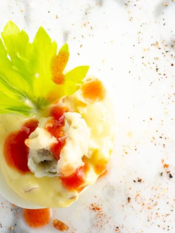 a Buffalo deviled egg on a marble background