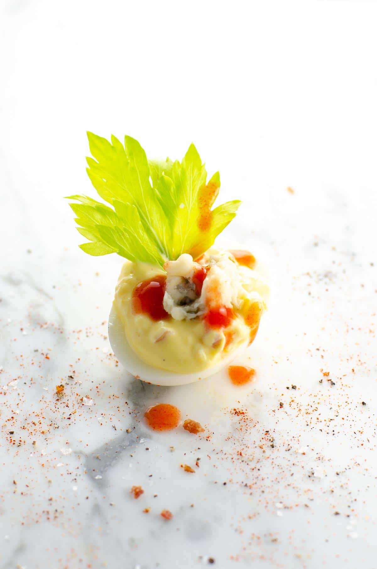 a Buffalo deviled egg on a marble background
