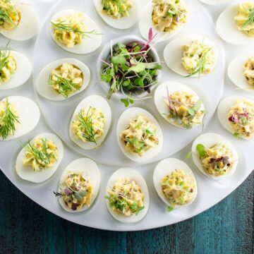 nicoise deviled eggs with tuna on a serving platter