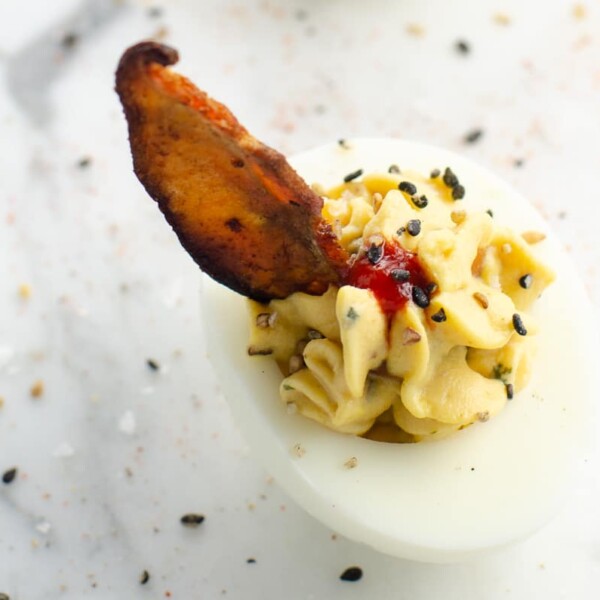 an ultimate miso deviled egg on a marble background