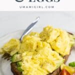 avocado toast with scrambled egg on a plate with a fork
