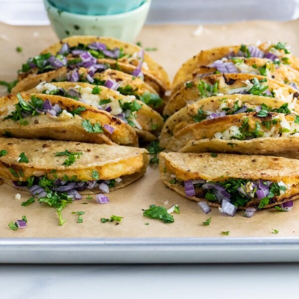 crispy potato tacos (tacos de papa) on a sheet pan