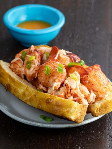 connecticut lobster roll recipe in a homemade top split bun with lemony butter sauce