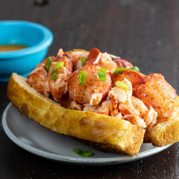 connecticut lobster roll recipe in a homemade top split bun with lemony butter sauce
