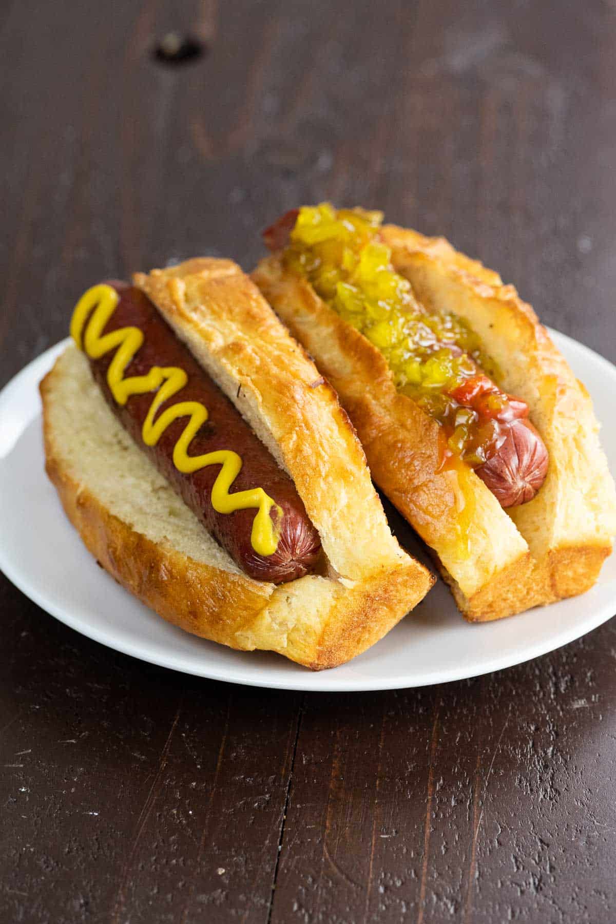 two hot dogs in new england style hot dog buns