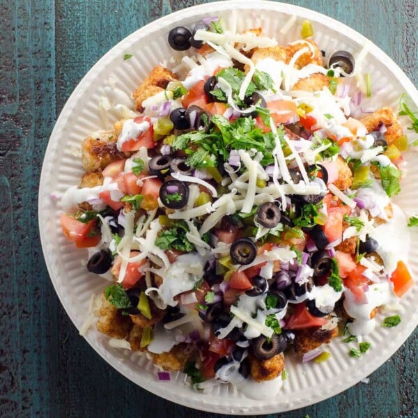 totchos (tater tot nachos) piled high on a plate