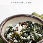 a bowl of cooking greens with bacon and feta