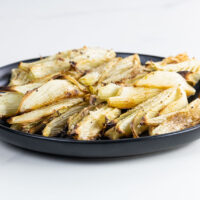 roasted fennel with lemon and parmesan on a plate