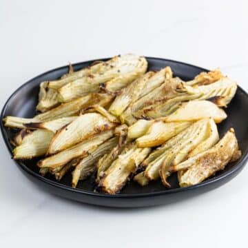 roasted fennel with lemon and parmesan on a plate