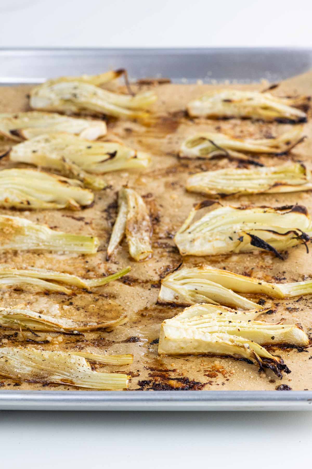 roasted fennel with lemon and parmesan on a sheet pan