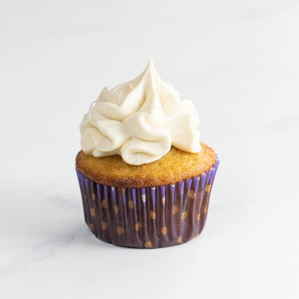 an ultimate vanilla cupcake with whipped buttercream frosting