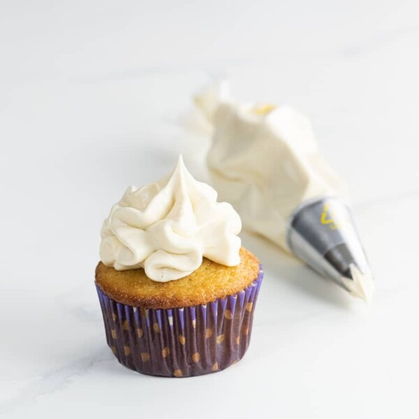 an ultimate vanilla cupcake with whipped buttercream frosting