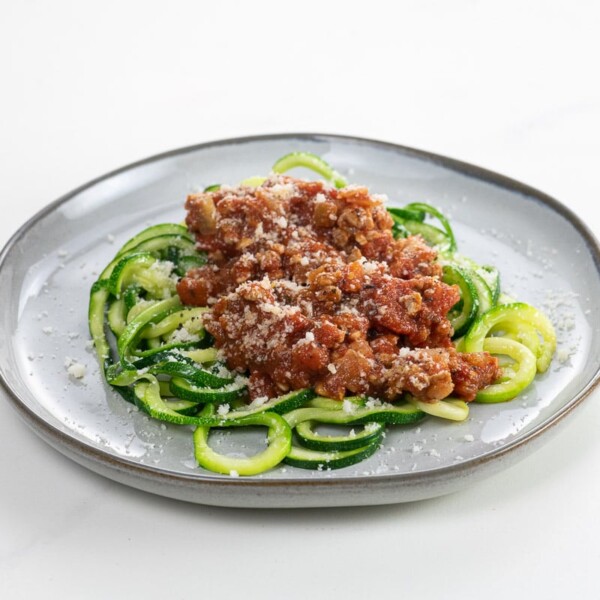 zoodle spaghetti wtih turkey meat sauce on a plate