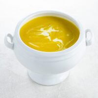 creamy butternut squash soup in a white tureen