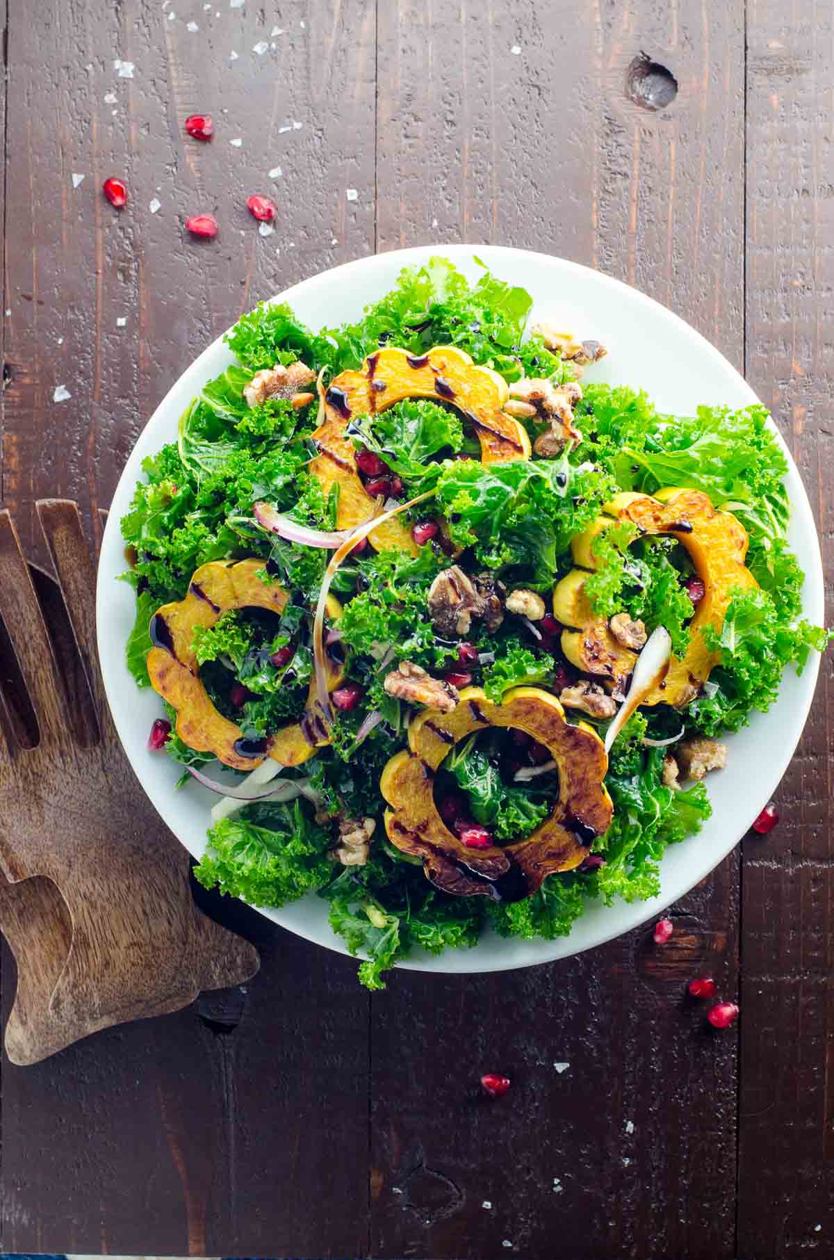 fall kale salad with delicata squash on a plate